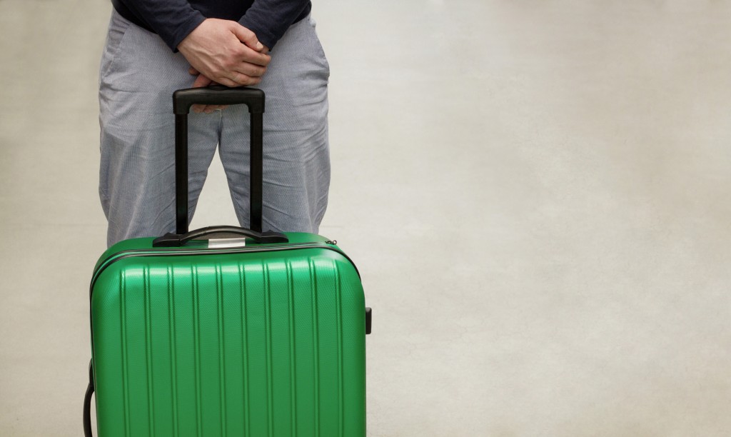 man with green luggage