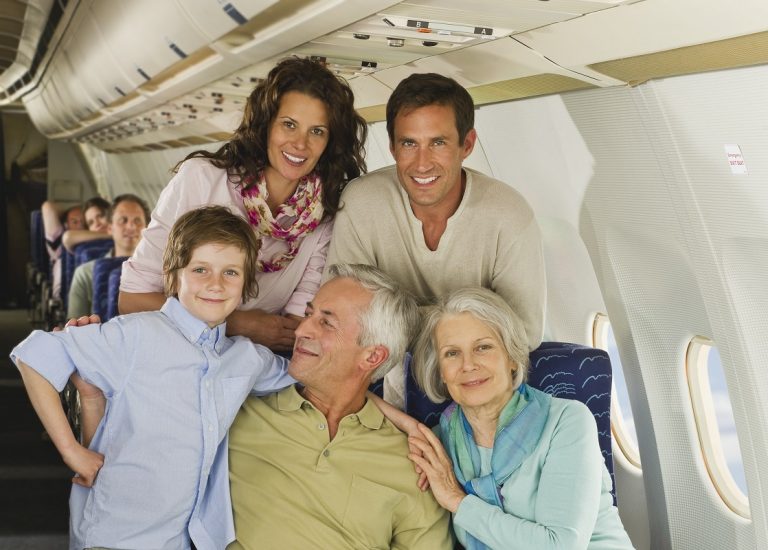 family sitting on airplane