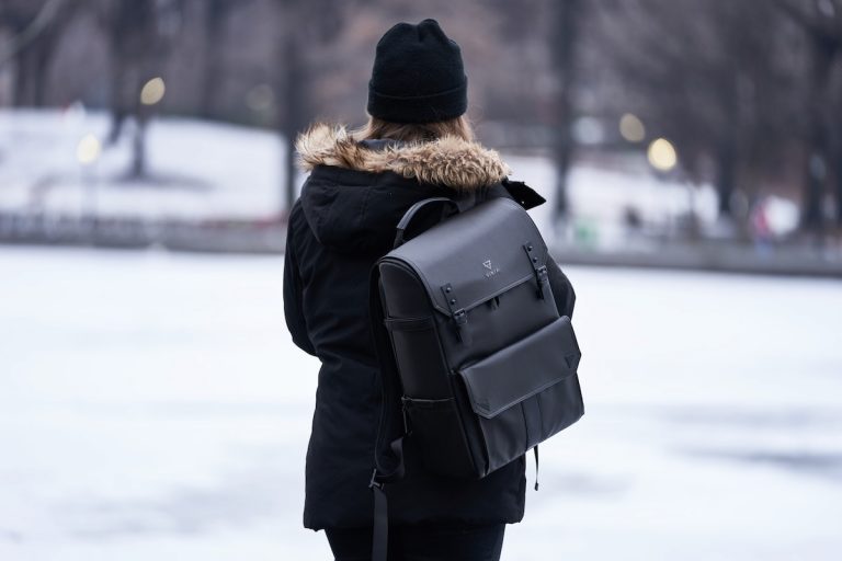 woman carrying a backpack during winter